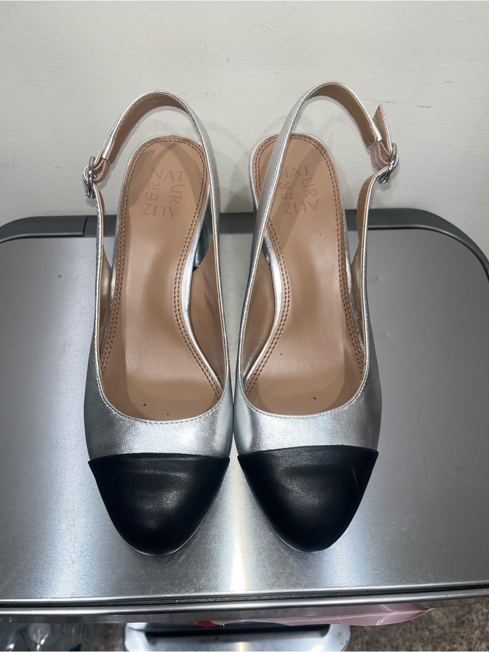 Metallic cap toe slingback pumps